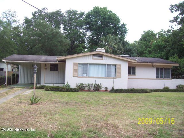 1740 Furman Road Jacksonville, FL 32217 - Photo 1 of 7 a front view of a house with a yard