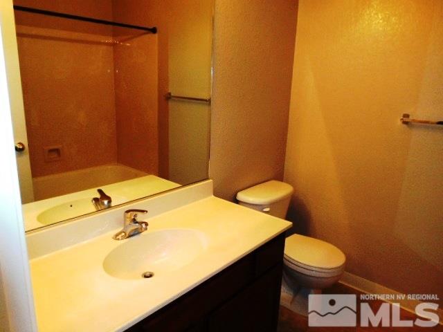 10085 Hampton Park Drive Reno, NV 89521 - Photo 13 of 20 a bathroom with a sink and a vanity