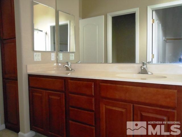10085 Hampton Park Drive Reno, NV 89521 - Photo 10 of 20 a bathroom with a sink and a mirror
