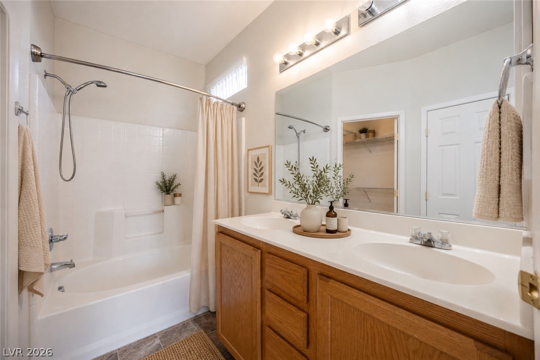 6320 Snap Ridge Street, Unit 201 North Las Vegas, NV 89081 - Photo 8 of 56 Dual vanity sinks provide ample space in this well-appointed bathroom.