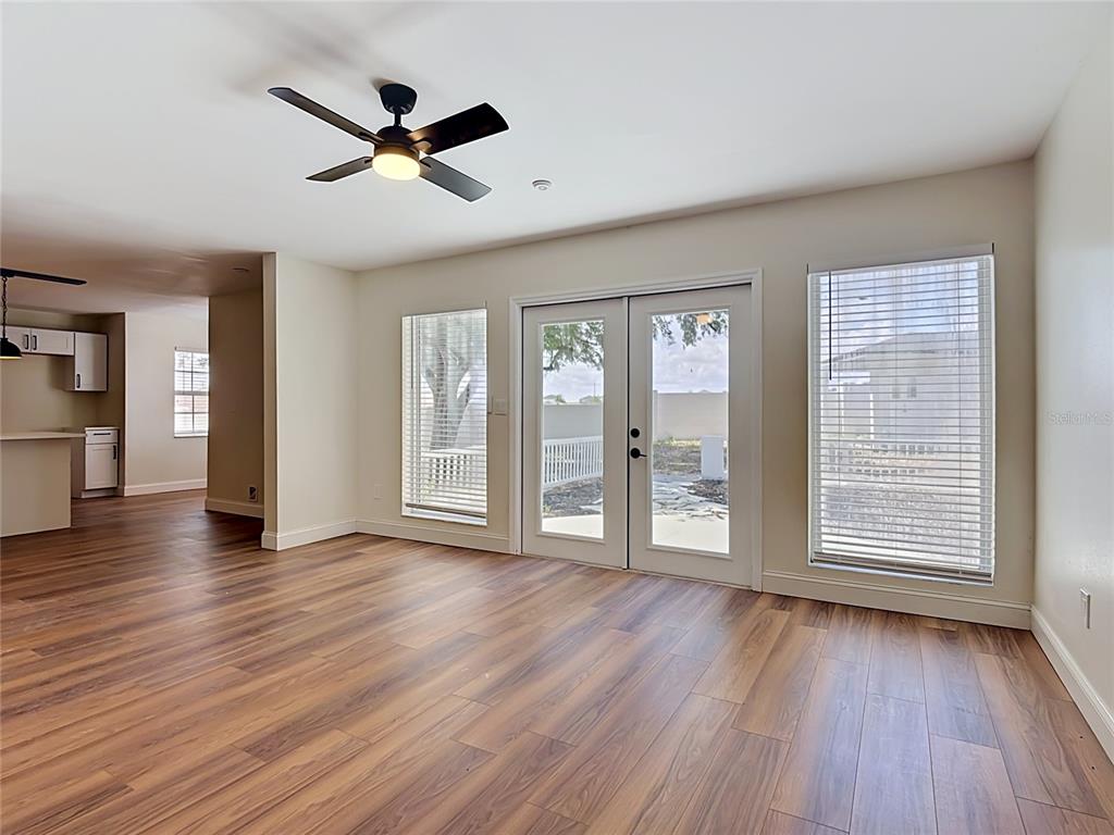 7925 Lake Mabel Loop Road Lake Wales, FL 33898 - Photo 17 of 97 a view of an empty room with a window and wooden floor