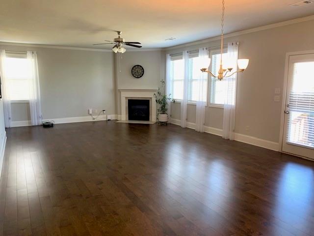 253 Orchard Trail Canton, GA 30115 - Photo 12 of 40 an empty room with wooden floor fireplace and windows