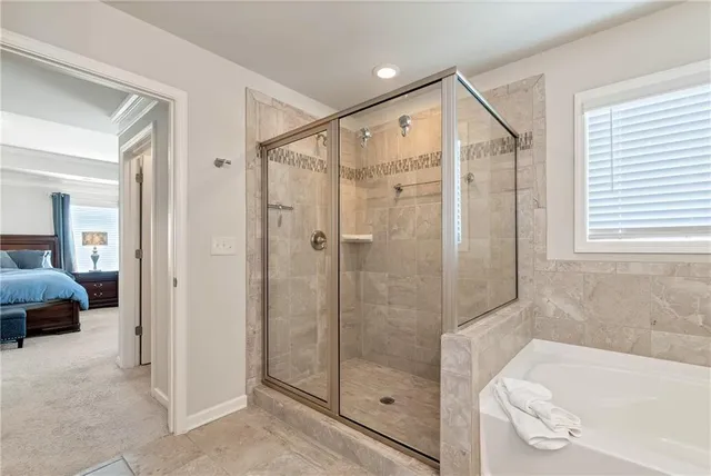 a bathroom with a shower and a bathtub