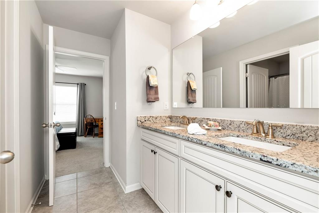 253 Orchard Trail Canton, GA 30115 - Photo 26 of 40 a bathroom with a sink and a mirror