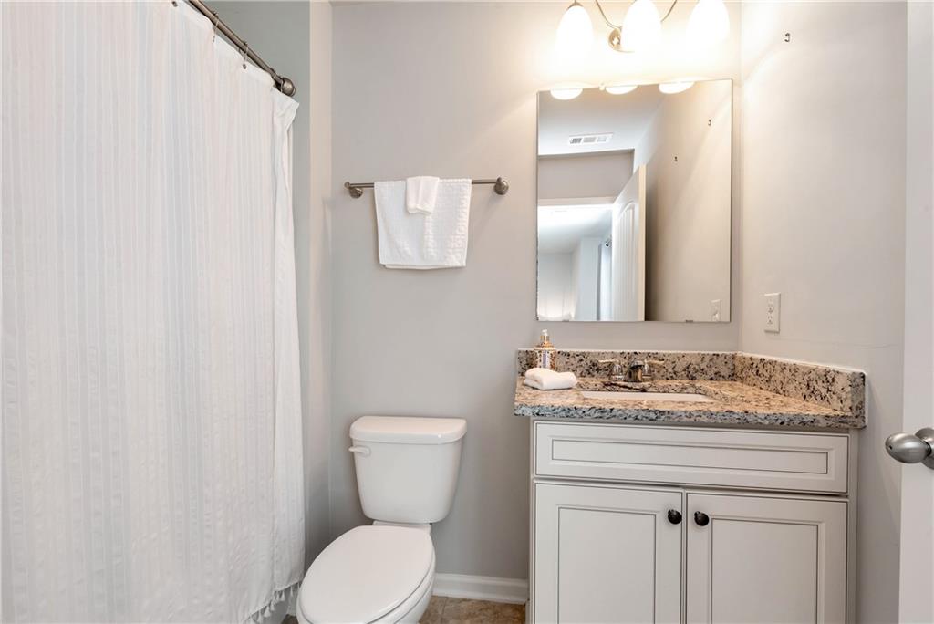 253 Orchard Trail Canton, GA 30115 - Photo 28 of 40 a bathroom with a sink and a toilet