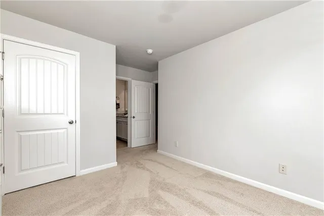 an empty room with a bathroom