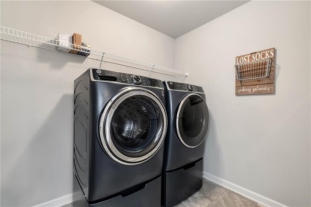 253 Orchard Trail Canton, GA 30115 - Photo 29 of 40 a utility room with dryer and washer