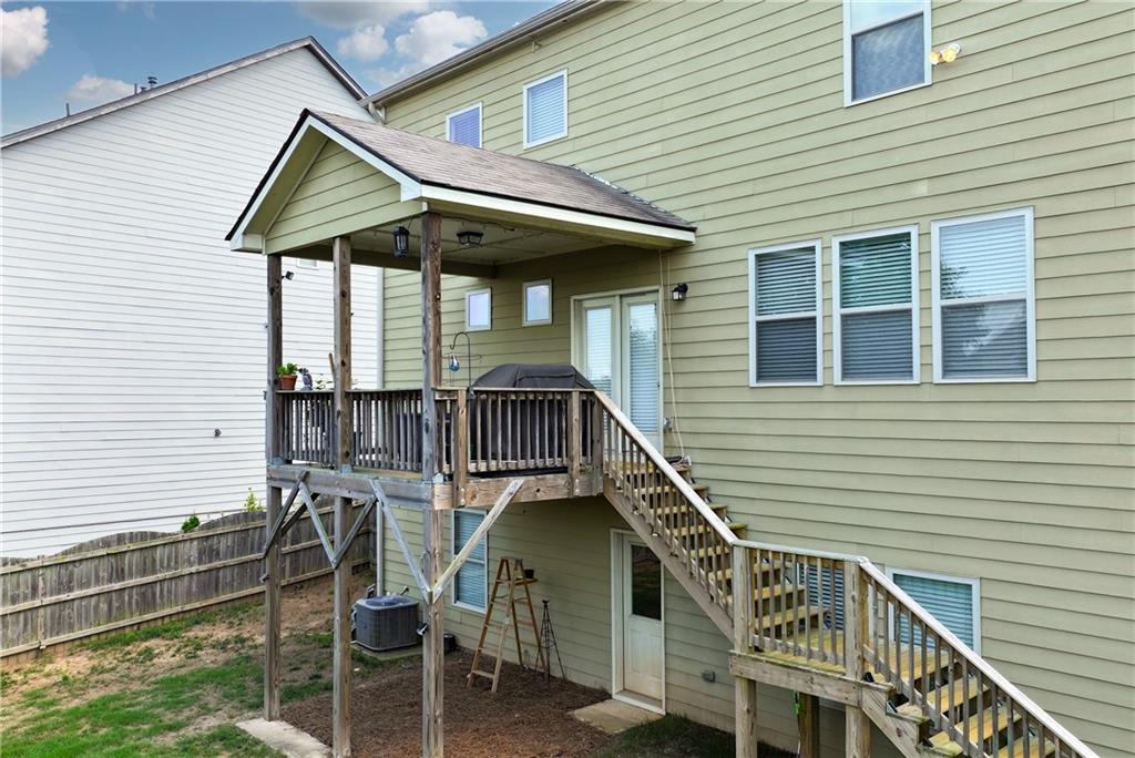 253 Orchard Trail Canton, GA 30115 - Photo 33 of 40 a view of house with a deck and furniture