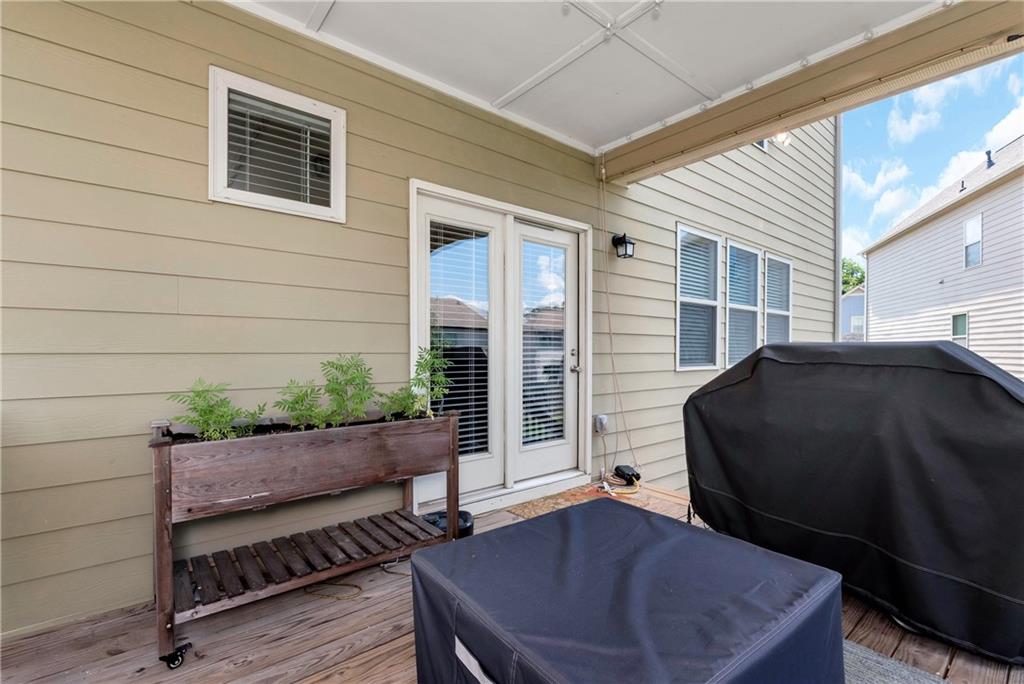 253 Orchard Trail Canton, GA 30115 - Photo 35 of 40 a view of a house with backyard and sitting area
