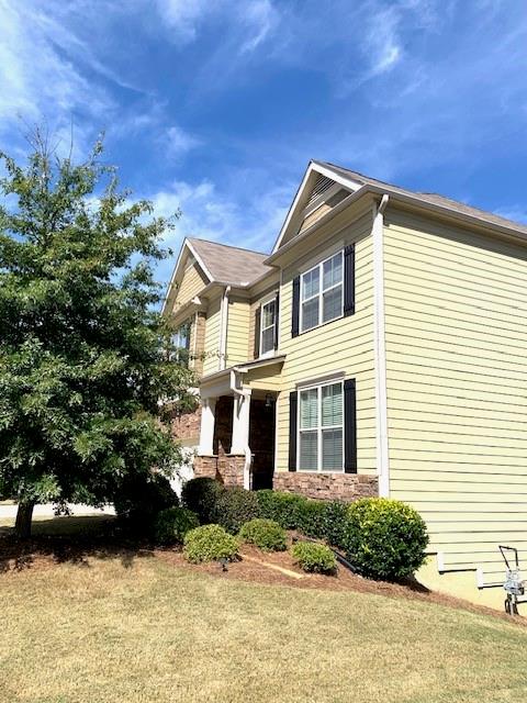 253 Orchard Trail Canton, GA 30115 - Photo 38 of 40 a front view of a house with a yard