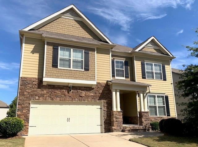 253 Orchard Trail Canton, GA 30115 - Photo 7 of 40 a front view of a house with a yard