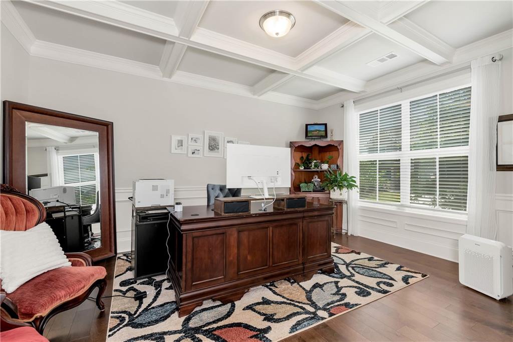253 Orchard Trail Canton, GA 30115 - Photo 9 of 40 a view of a workspace with furniture and a window