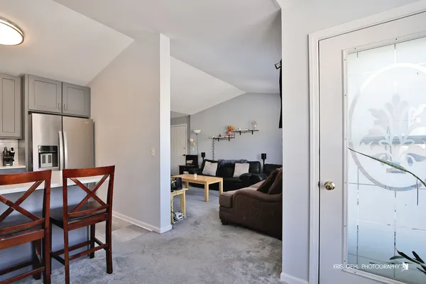 a view of a living room and dining room