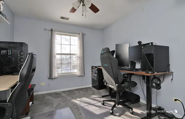 a view of workspace with windows recliner chair