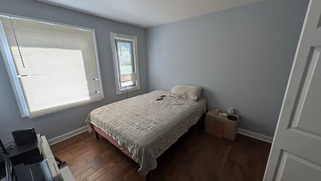 a bedroom with a bed and a closet