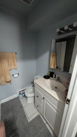 a view of a hallway with wooden floor and stairs