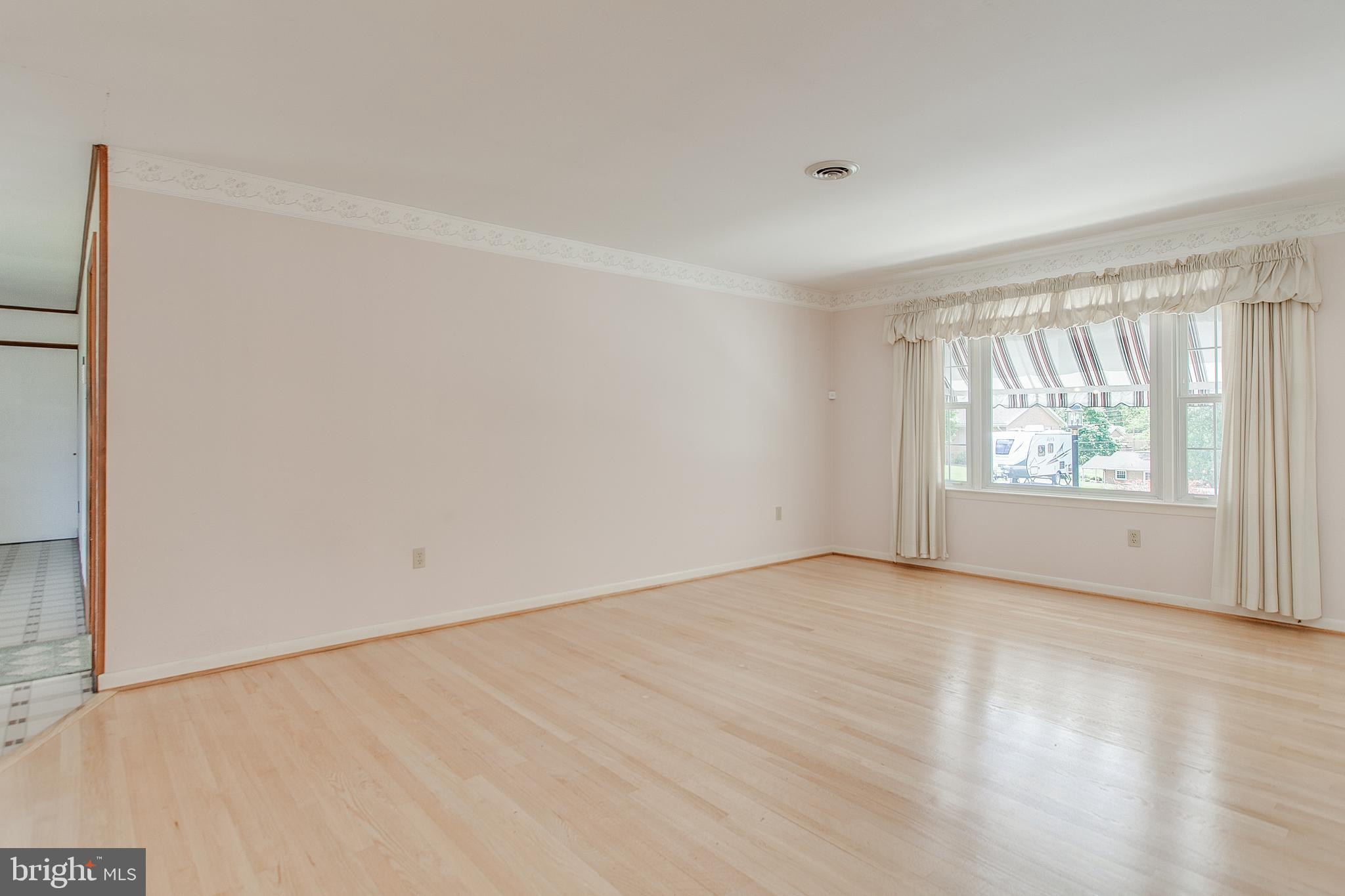 13831 Northcrest Road Hagerstown, MD 21742 - Photo 5 of 37 Living Room with HW Floors & Picture Window
