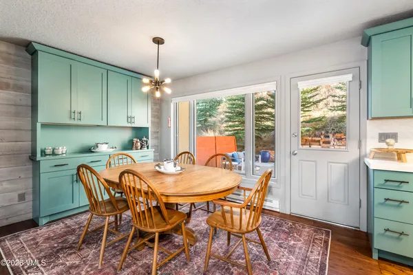 a view of a dining room with furniture window and outside view