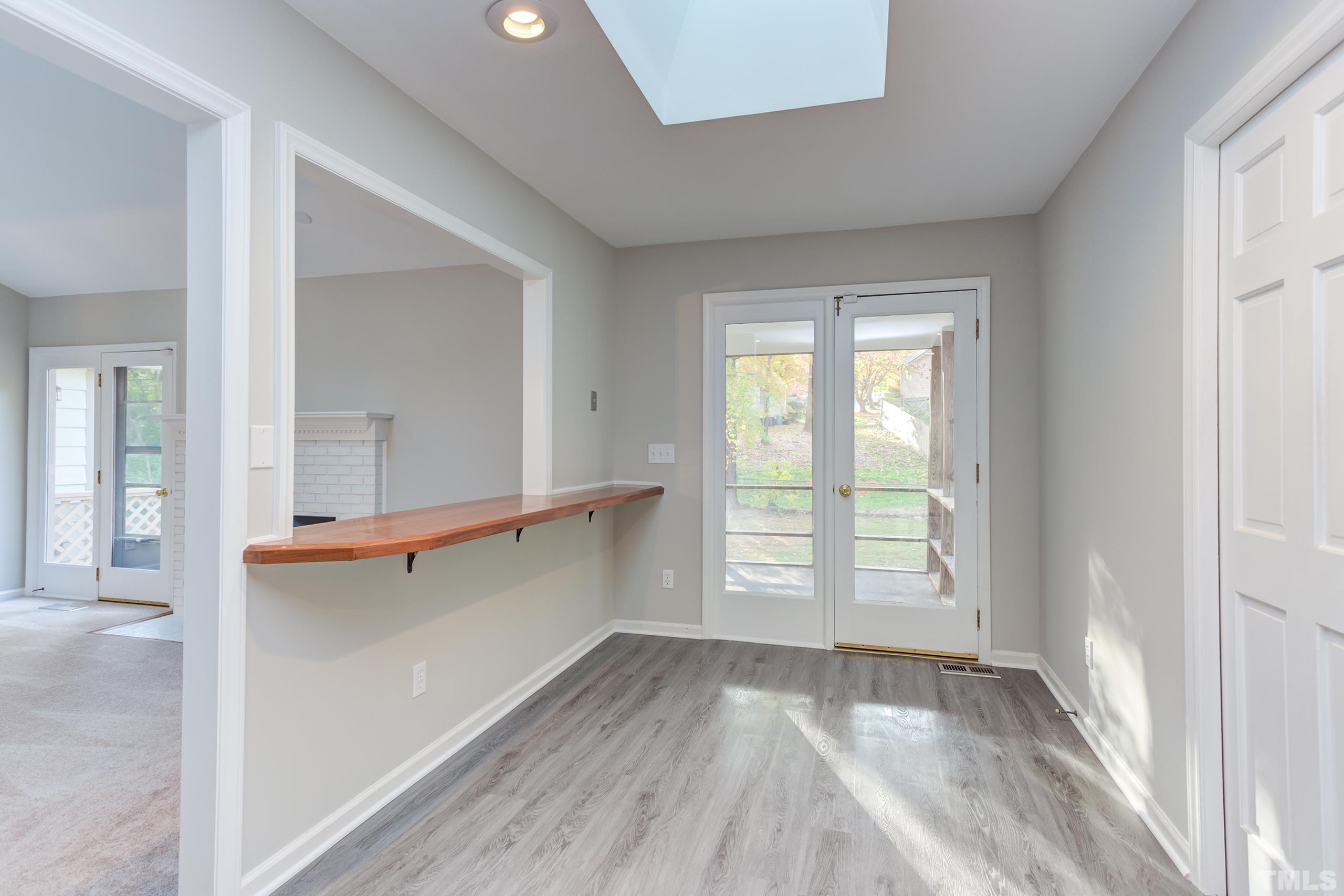 6929 Three Bridges Circle Raleigh, NC 27613 - Photo 14 of 28 an empty room with wooden floor and windows