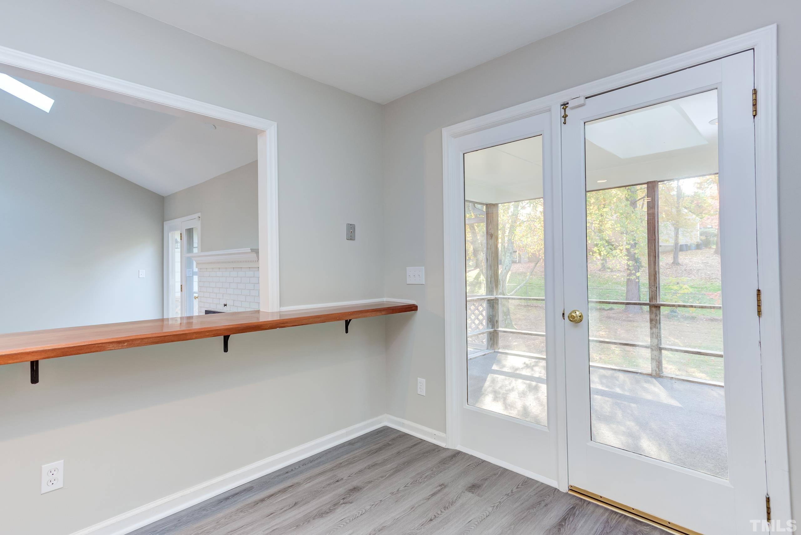 6929 Three Bridges Circle Raleigh, NC 27613 - Photo 22 of 28 a view of an empty room with wooden floor and a window