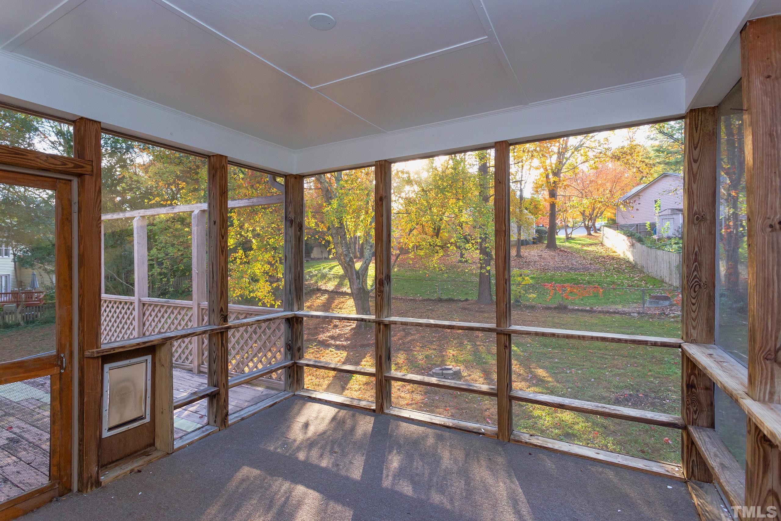 6929 Three Bridges Circle Raleigh, NC 27613 - Photo 24 of 28 wooden floor in an empty room with glass windows