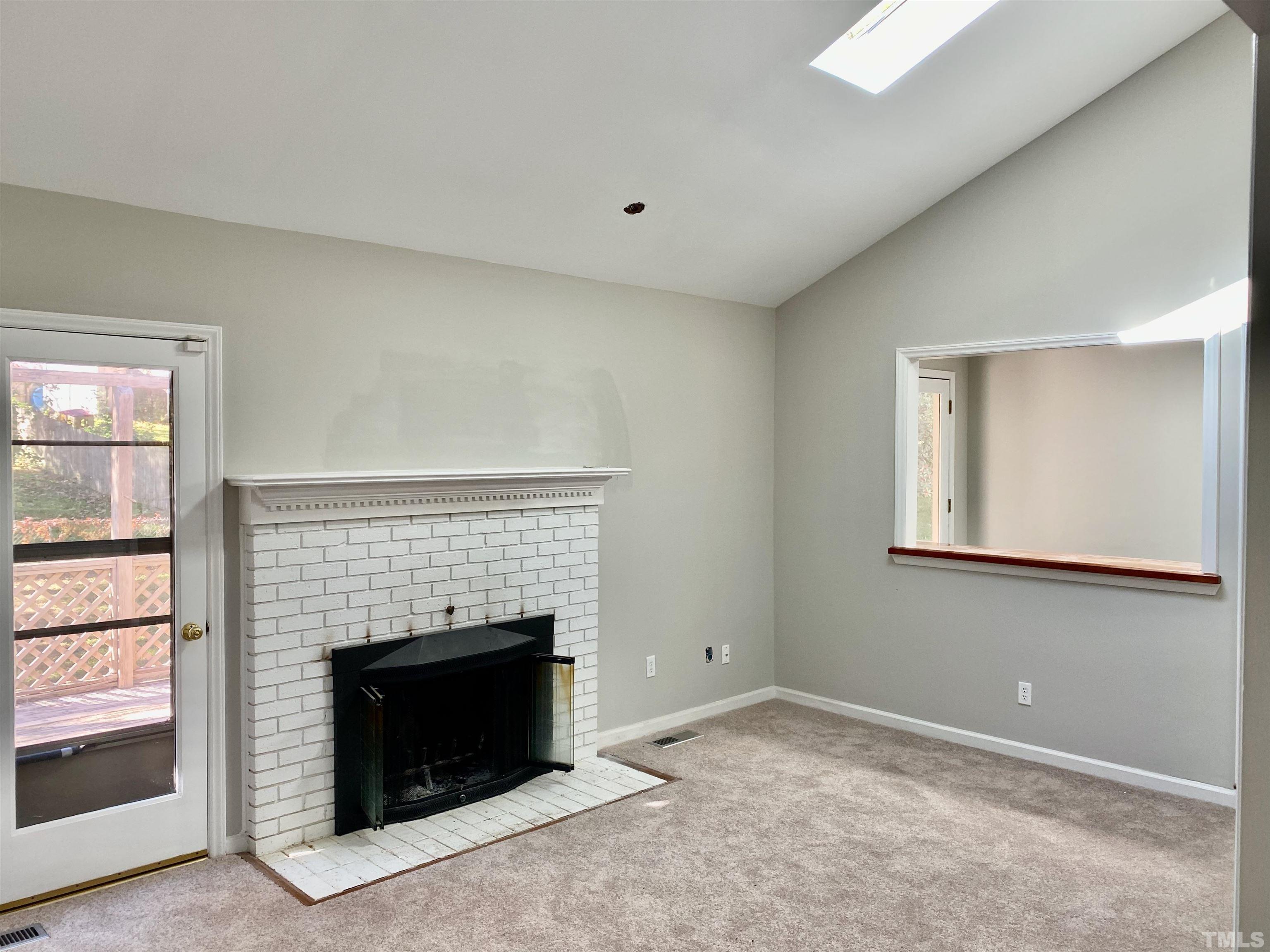 6929 Three Bridges Circle Raleigh, NC 27613 - Photo 4 of 28 a living room with a fireplace