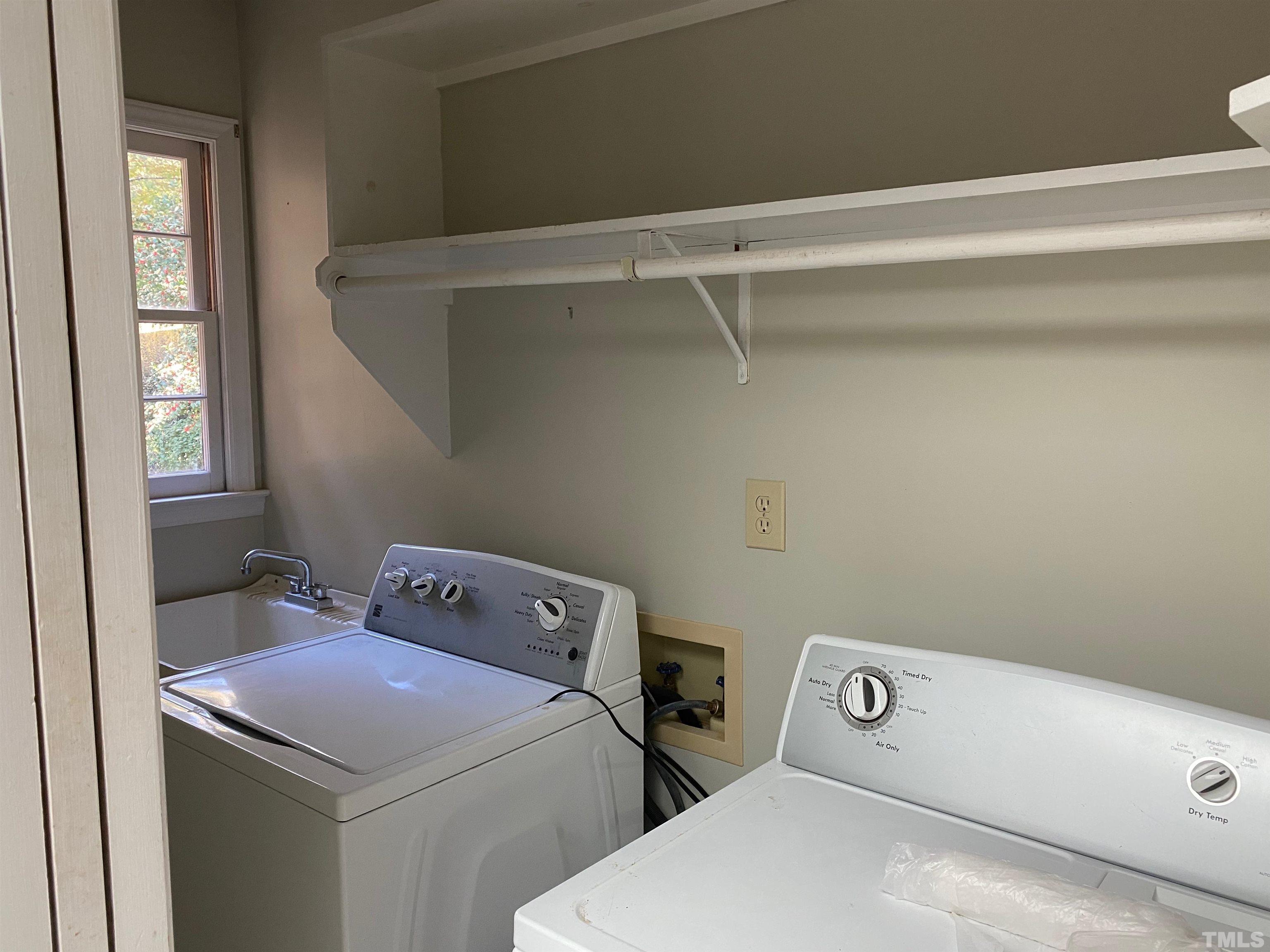 6929 Three Bridges Circle Raleigh, NC 27613 - Photo 7 of 28 a utility room with dryer and washer