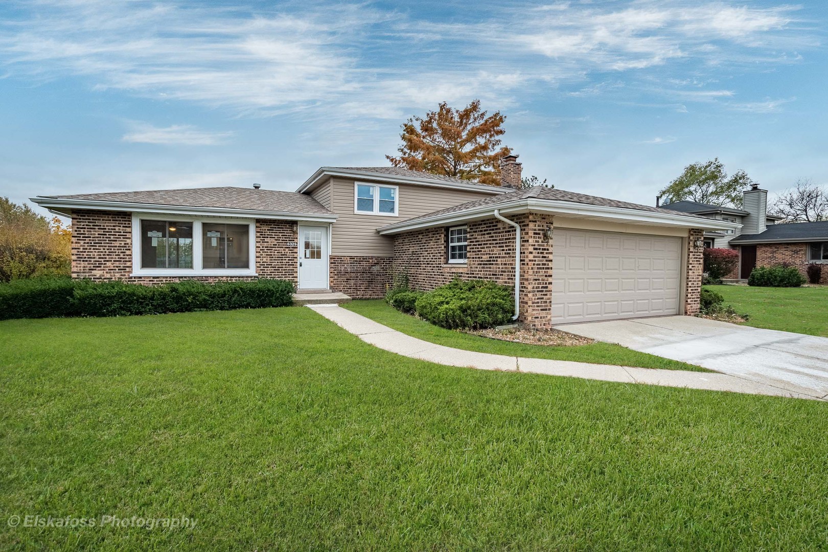 6329 Beaver Dam Road Matteson, IL 60443 - Photo 1 of 21 a front view of a house with a garden and plants