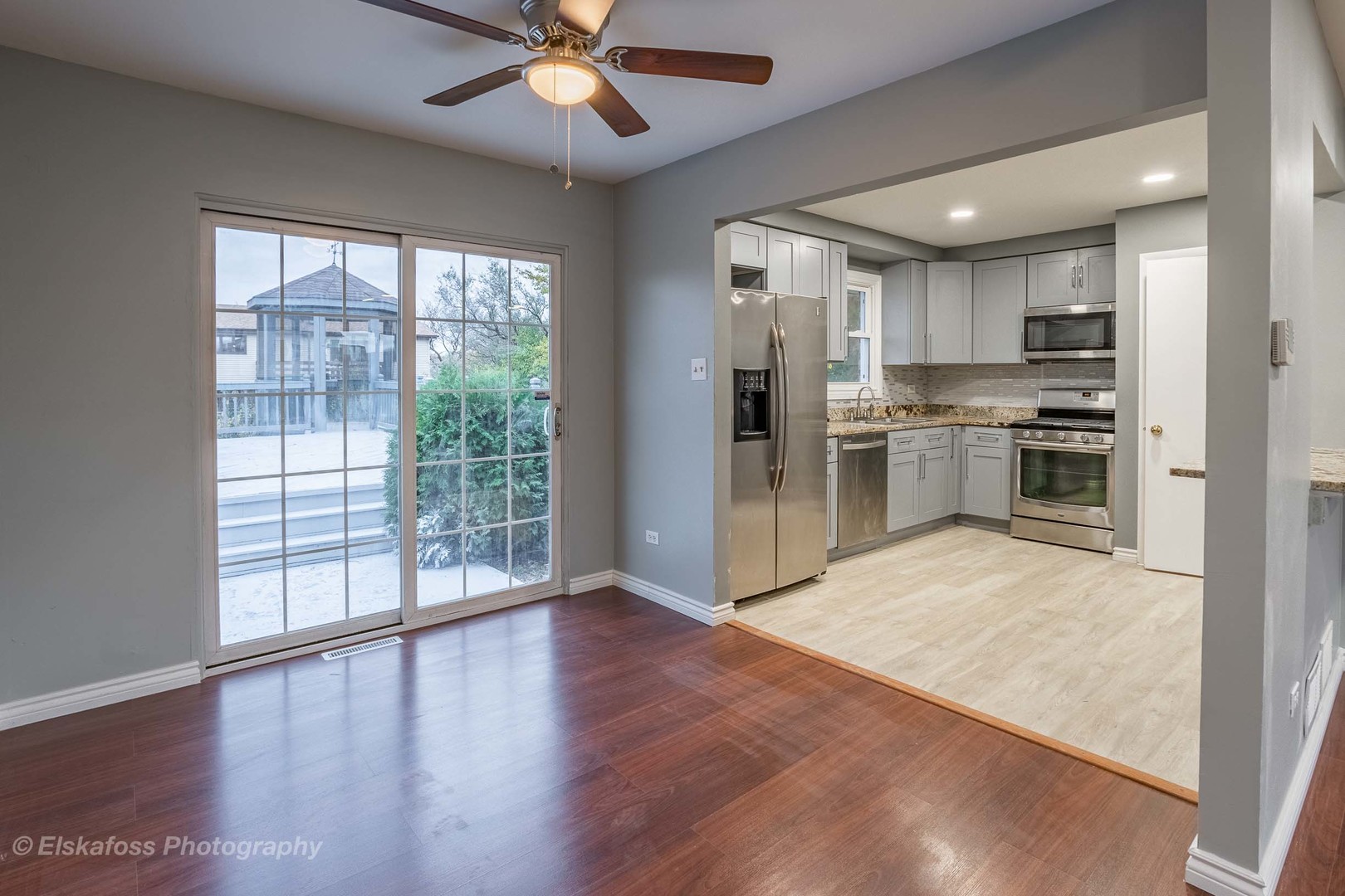 6329 Beaver Dam Road Matteson, IL 60443 - Photo 3 of 21 a view of a kitchen with a stove cabinets and wooden floor