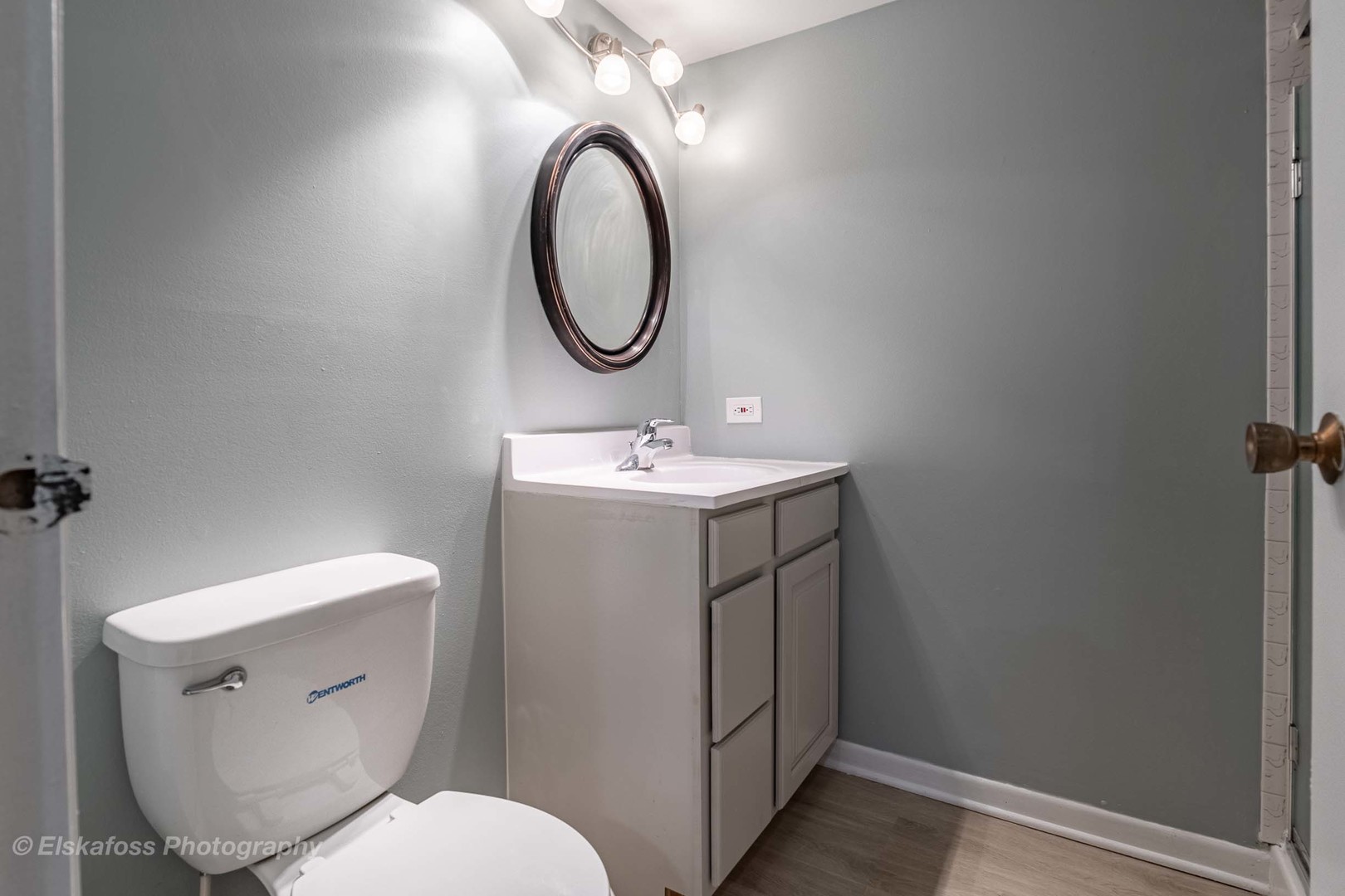 6329 Beaver Dam Road Matteson, IL 60443 - Photo 10 of 21 a bathroom with a toilet sink vanity and mirror