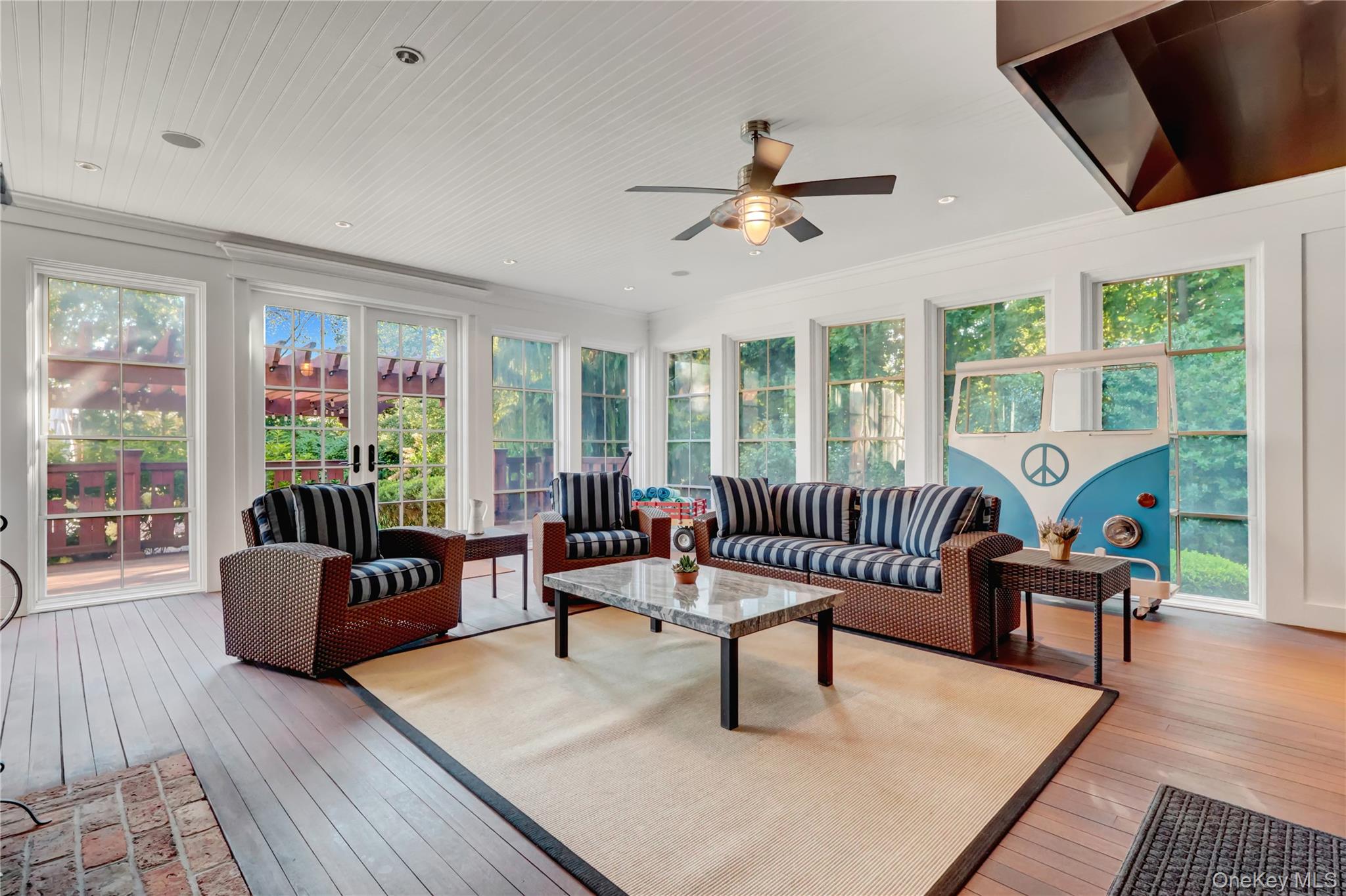 63 Dyke Road Setauket, NY 11733 - Photo 37 of 49 Sunroom / solarium featuring hardwood / wood-style floors and ornamental molding