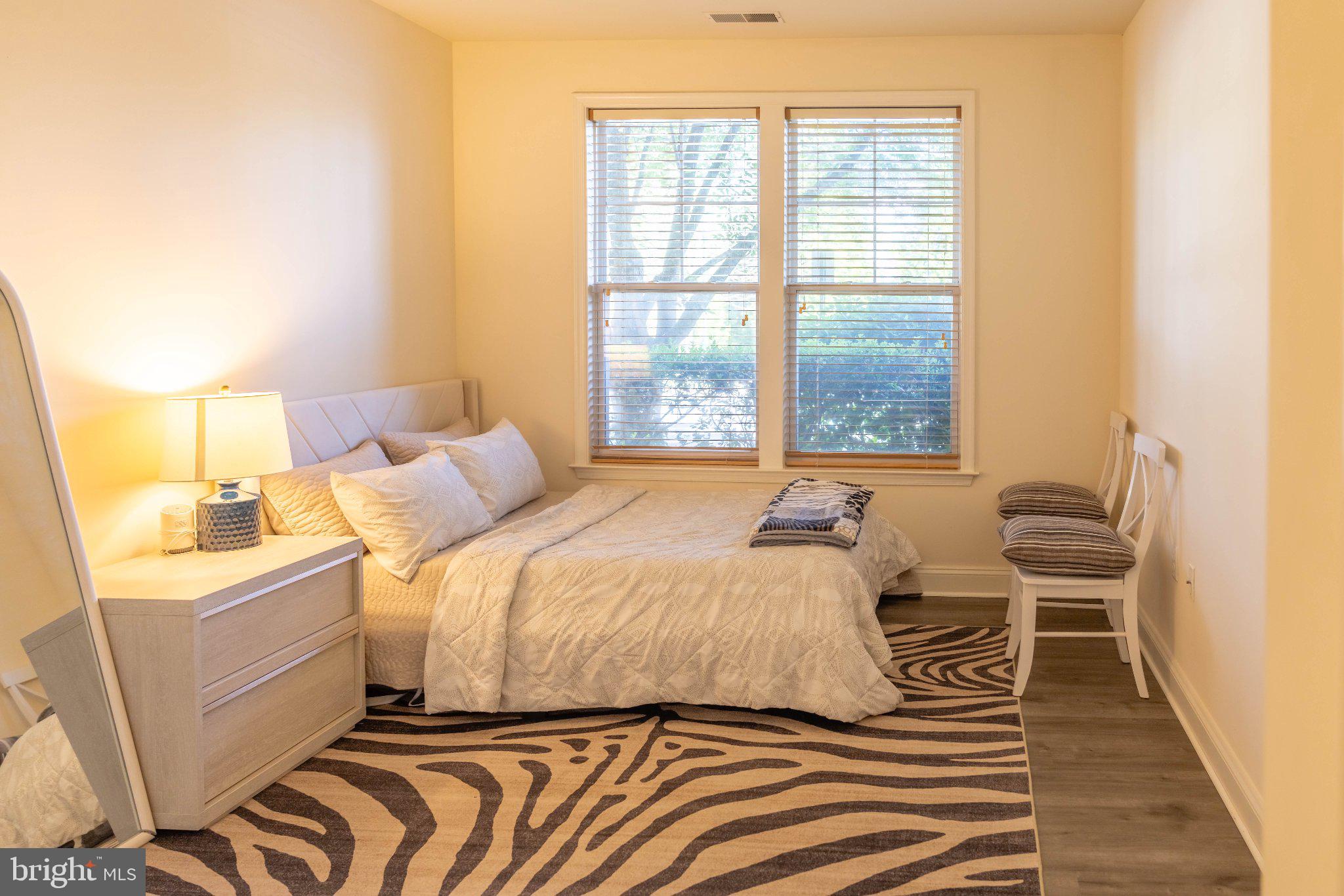 12824 Clarksburg Square Road, Unit 105 Clarksburg, MD 20871 - Photo 59 of 96 Serene bedroom with natural light.