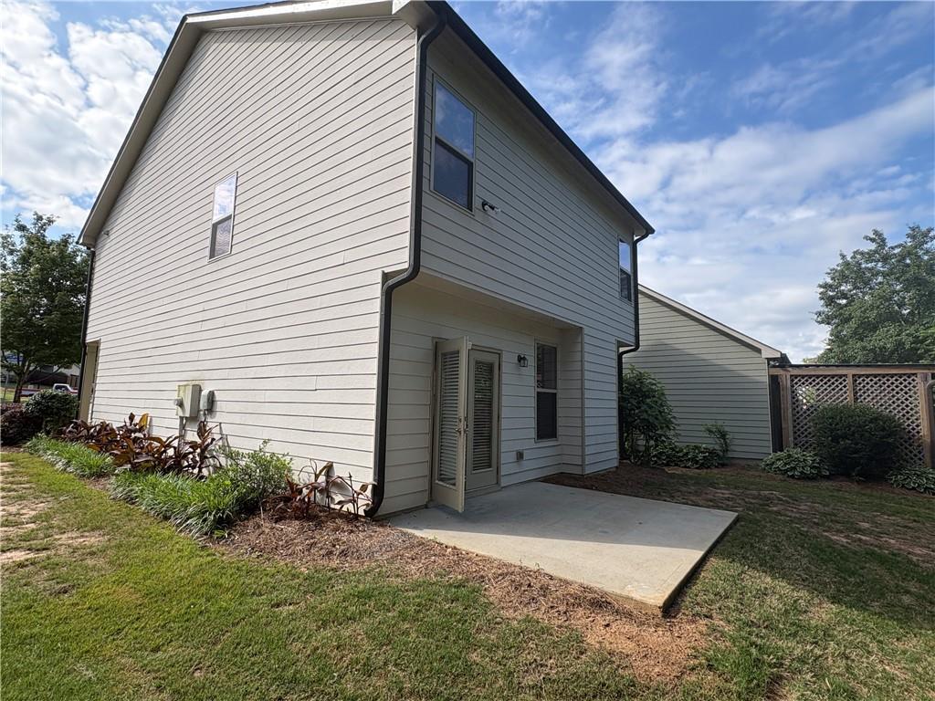 5934 Watersdown Way Flowery Branch, GA 30542 - Photo 2 of 28 a view of a house with backyard and garden