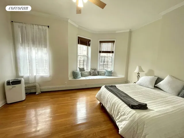 a room with pool table and windows