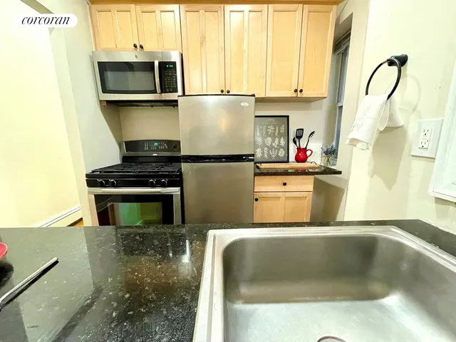 a view of a balcony with chairs and wooden fence