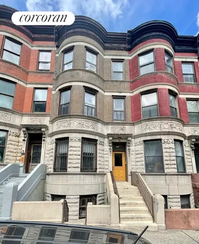 a kitchen with a refrigerator a sink and a stove