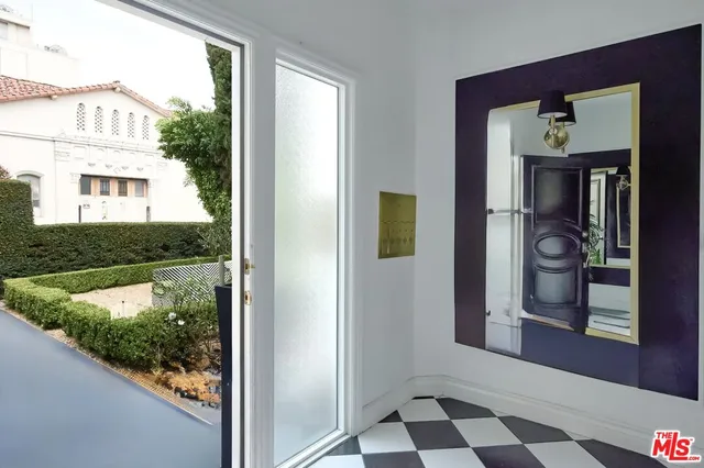 a view of a door and a window