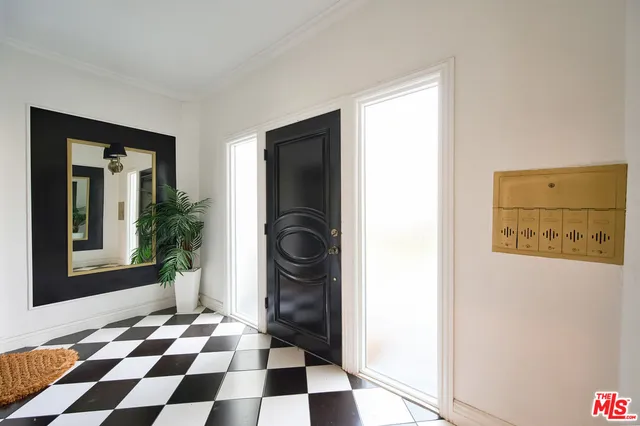 a view of a storage & utility room with a washing machine