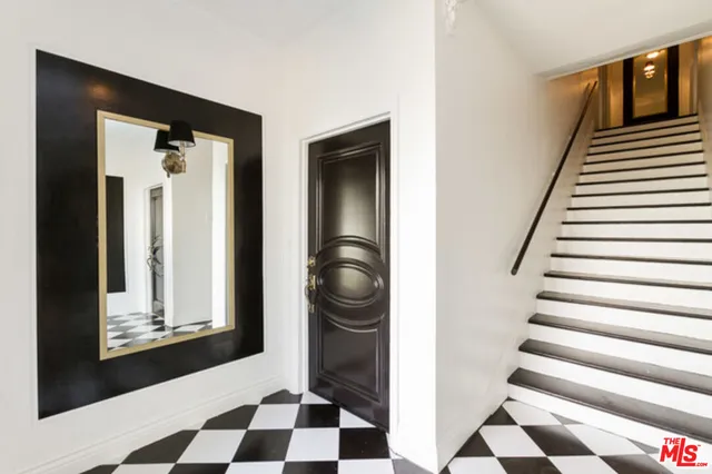 a view of a hallway to a bedroom