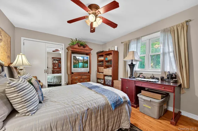a bedroom that has a bed and a chandelier