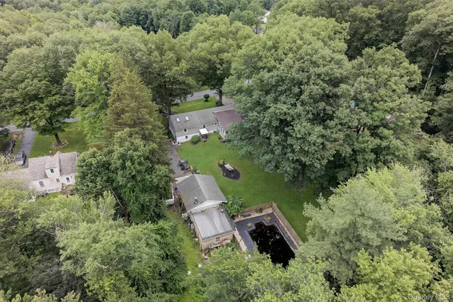 an aerial view of a house with outdoor space and street view