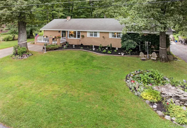 a front view of a house with garden