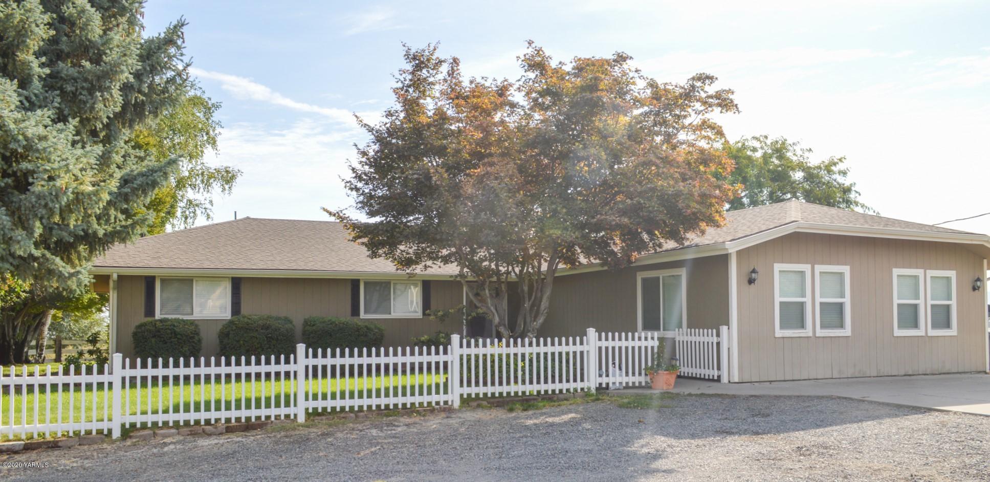 250 West Canyon Road Yakima, WA 98908 - Photo 1 of 27 a front view of a house with a fence