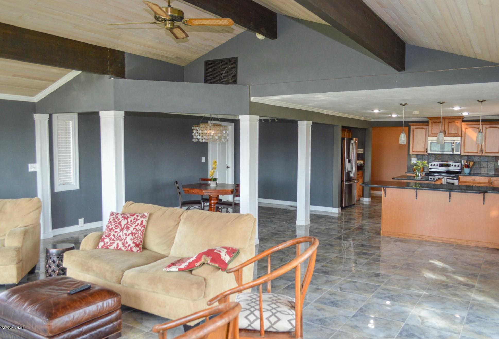 250 West Canyon Road Yakima, WA 98908 - Photo 7 of 27 a living room with furniture and kitchen view
