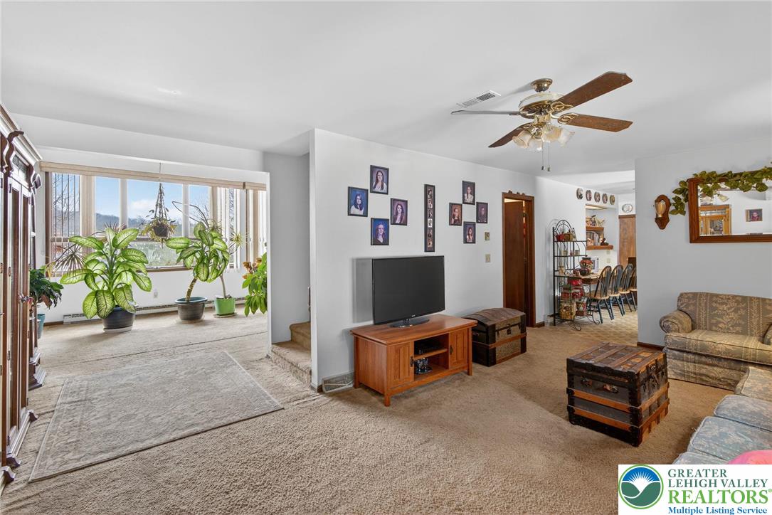 4793 Main Road West Emmaus, PA 18049 - Photo 38 of 81 a living room with furniture and a flat screen tv