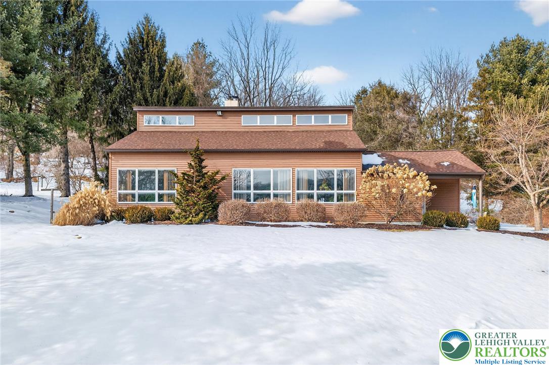 4793 Main Road West Emmaus, PA 18049 - Photo 5 of 81 a front view of a house with a yard and garage