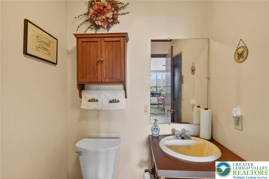 4793 Main Road West Emmaus, PA 18049 - Photo 54 of 81 a bathroom with a toilet sink and mirror