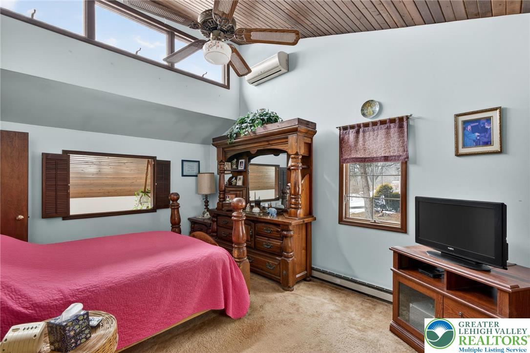 4793 Main Road West Emmaus, PA 18049 - Photo 61 of 81 a bedroom with a bed and a flat screen tv