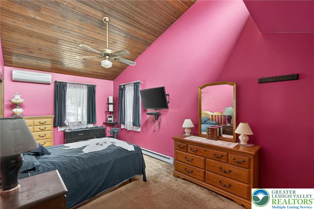 4793 Main Road West Emmaus, PA 18049 - Photo 64 of 81 a bedroom with a bed and a dresser