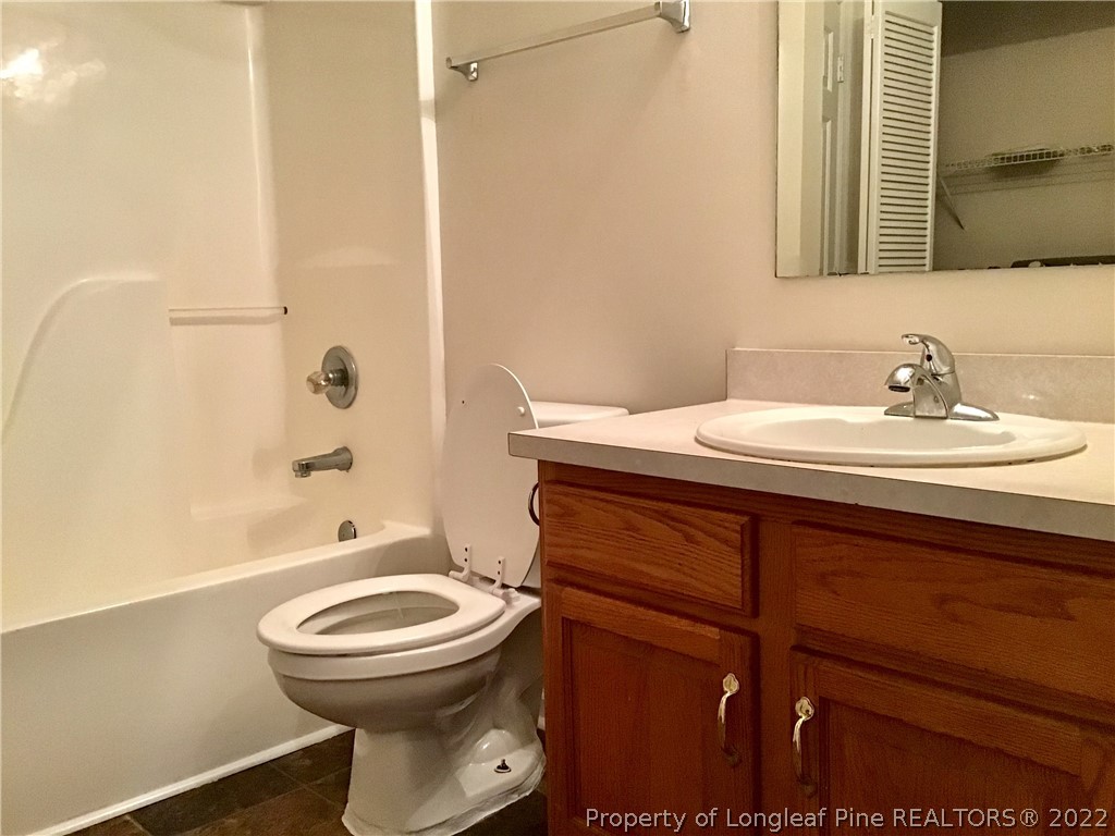1824 Sardonyx Road, Unit 2 Fayetteville, NC 28303 - Photo 12 of 20 a bathroom with a sink a toilet and shower